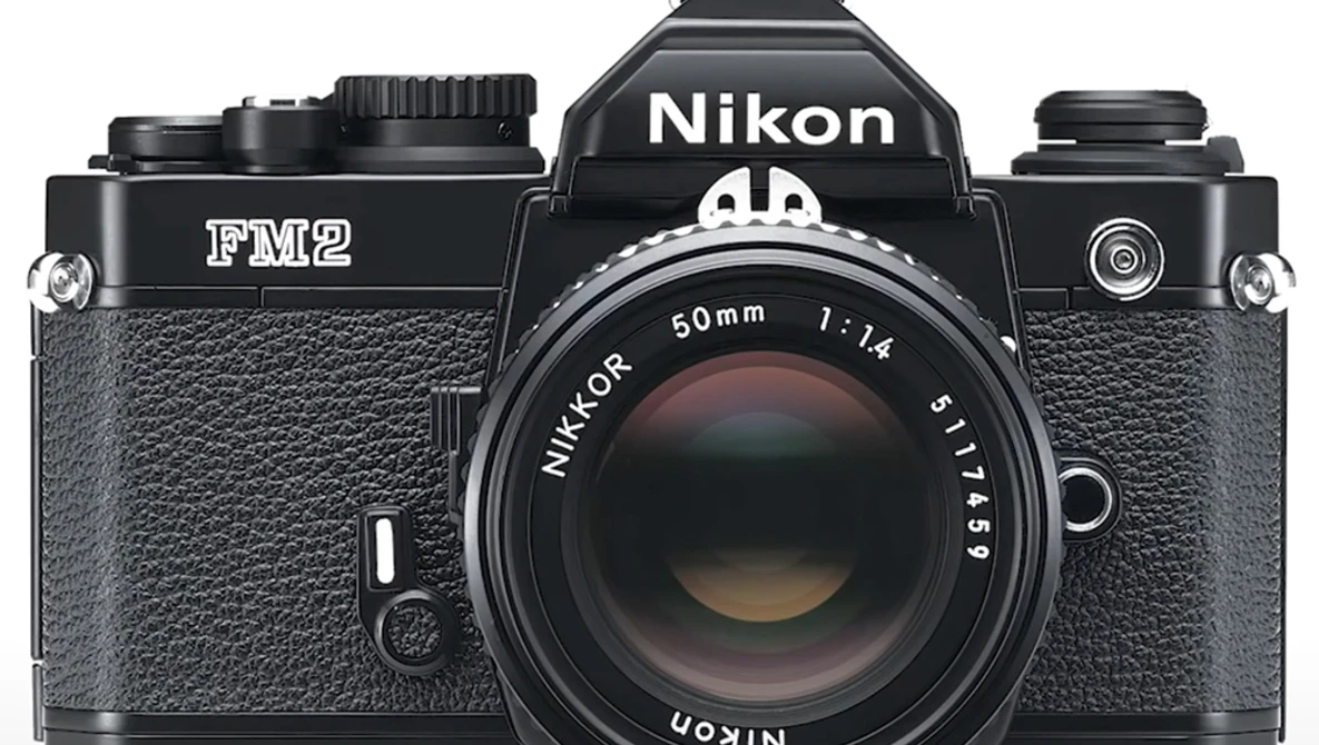 Nikon FM2 35mm film camera with Nikkor 50mm f/1.4 lens, front view on white background.