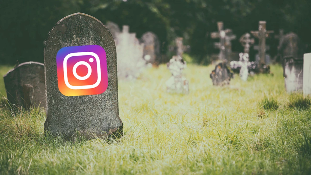 Instagram logo superimposed on a gravestone in a cemetery surrounded by other headstones.