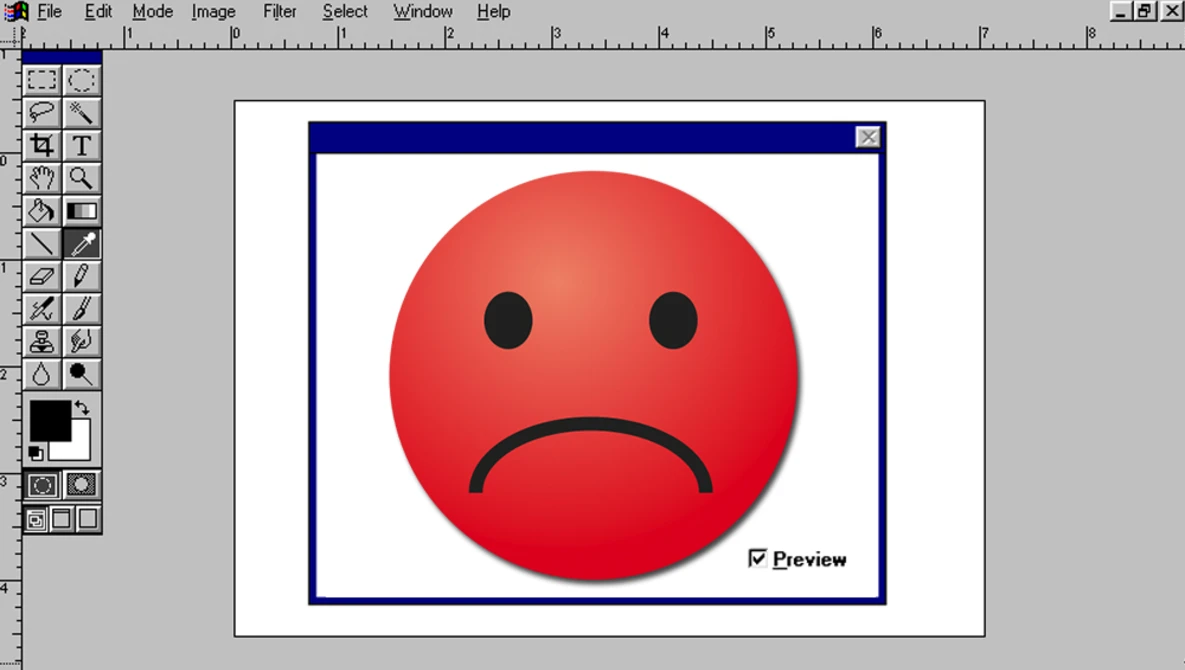 Screenshot of image editing software displaying a red smiley face with a frown expression.