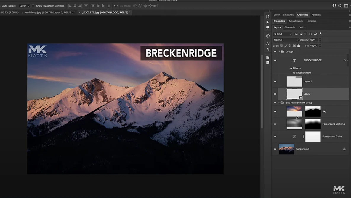 Snow-covered mountain peaks at sunset with warm golden light illuminating the slopes.