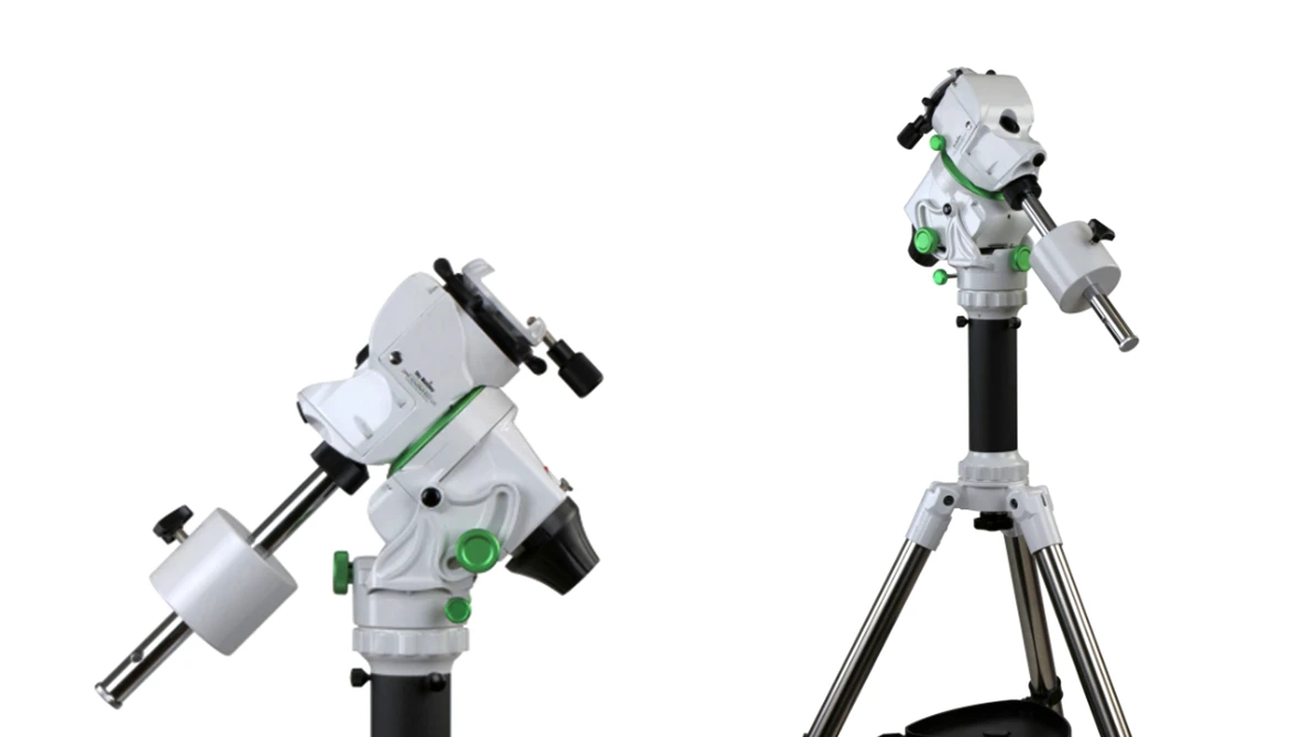 Two white and green equatorial telescope mounts shown from different angles on black tripod legs.