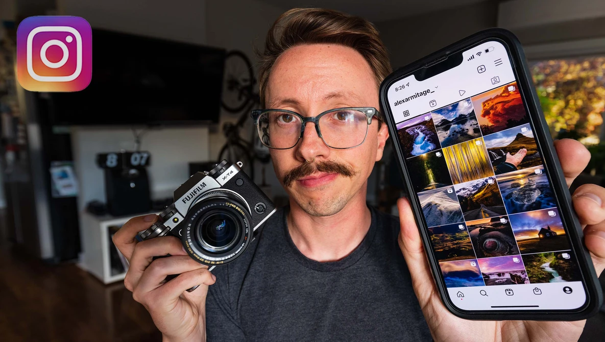 Photographer holding a vintage film camera in one hand and a smartphone displaying Instagram feed in the other.