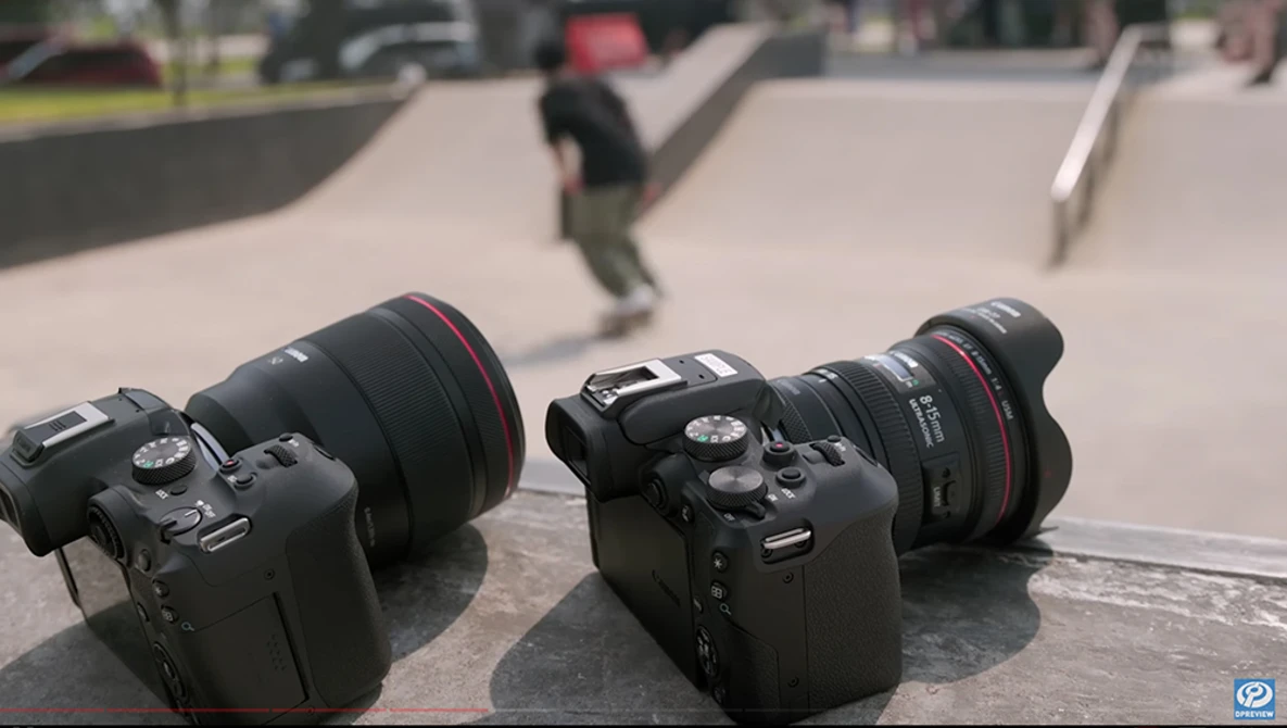 Two DSLR cameras with telephoto lenses positioned on concrete at a skate park with blurred skaters in background.