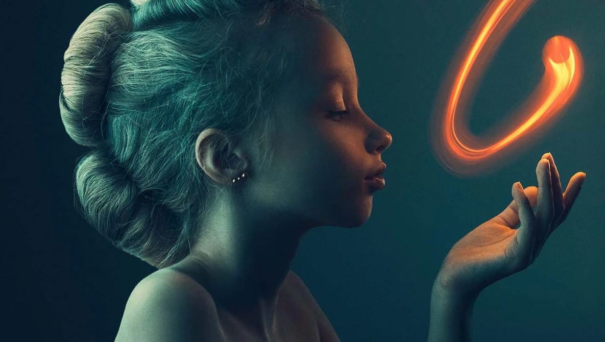 Woman in profile gazing at a glowing orange neon curve suspended in teal-lit darkness.