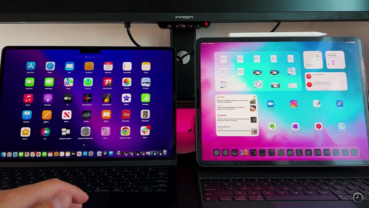 Two laptops side by side displaying different operating system home screens with app icons and widgets.
