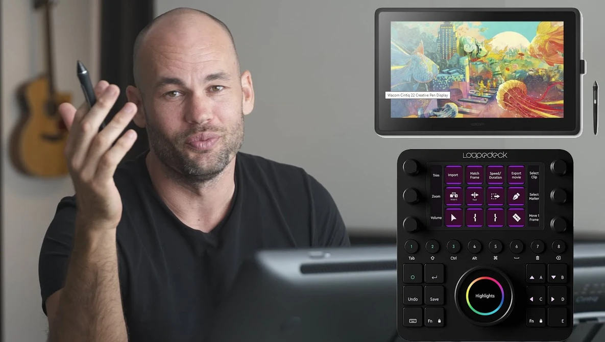 Man demonstrating a digital control panel with a display tablet mounted above showing colorful visual content.