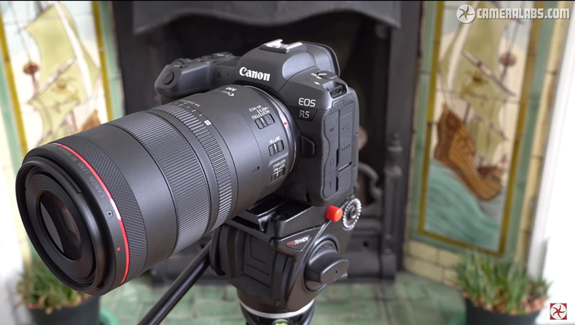 Canon EOS R5 mirrorless camera with telephoto lens mounted on tripod head.