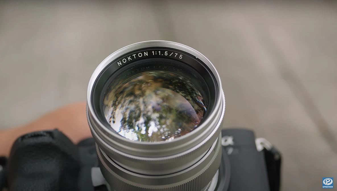 Horton 1:1.5776 telephoto lens mounted on camera body, showing spherical aberration and lens distortion in reflection.