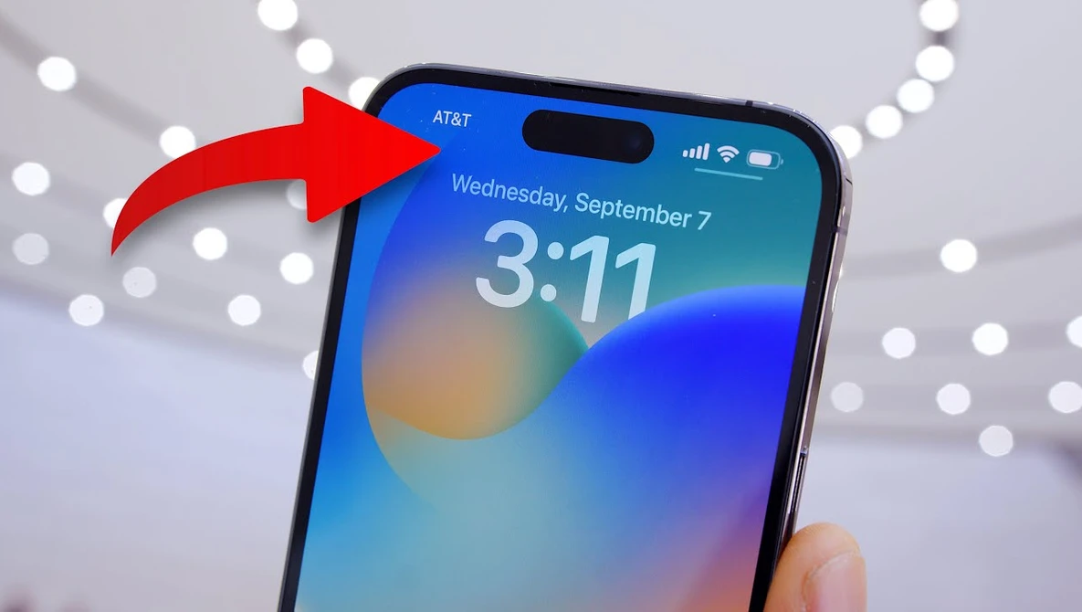 Screenshot of iPhone lock screen with time display and red arrow pointing to notch area.