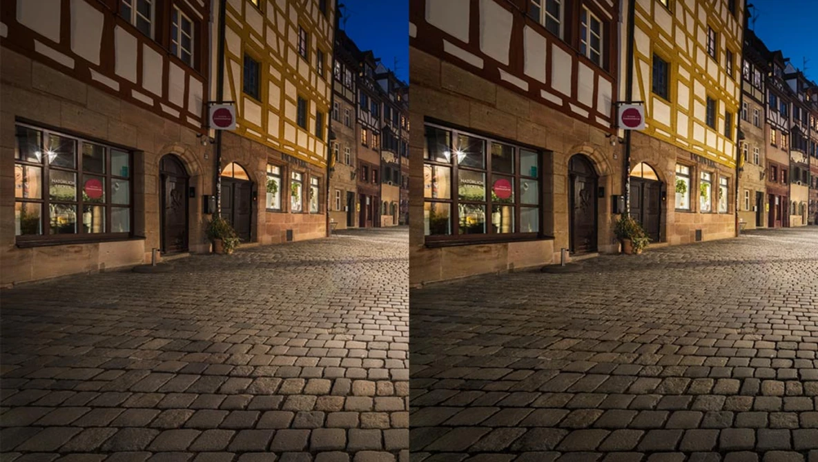 Side-by-side comparison of the same European street scene at night showing different color grading approaches.