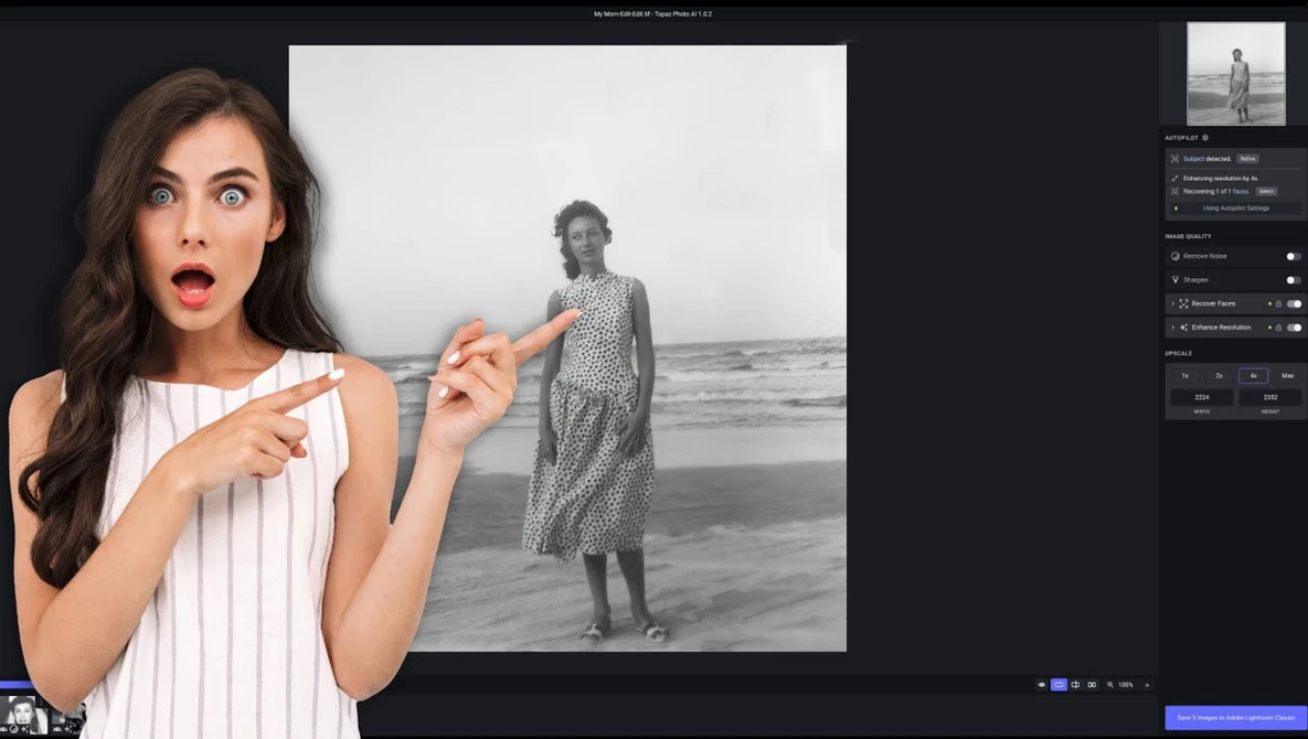 Woman in white pinstriped top gesturing toward black and white portrait of person standing in shallow ocean water.