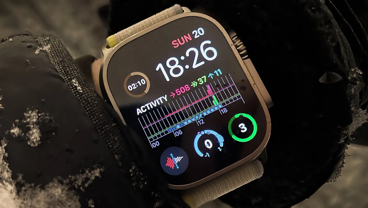 Screenshot of smartwatch displaying time, activity metrics, and health data on dark AMOLED screen.