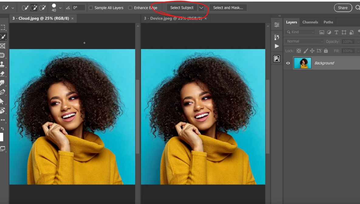 Portrait of a woman with curly hair wearing a yellow hoodie against a bright blue background.