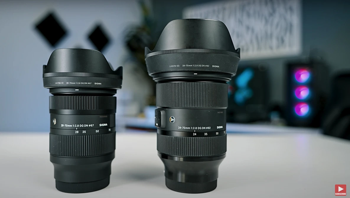 Two wide-angle zoom lenses with lens hoods displayed side by side on a white surface.