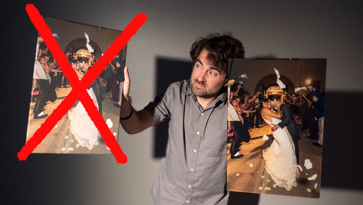 Man in button-up shirt holding two photographs with red X marked over one image.