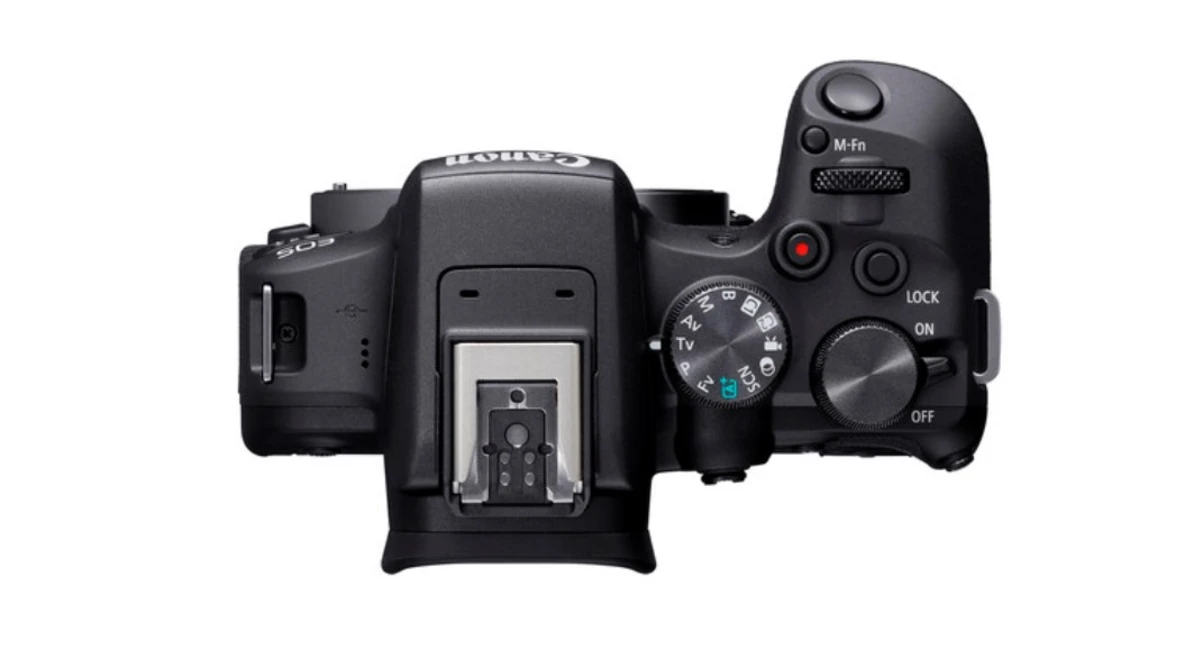 Top-down view of a black mirrorless camera body with dual control wheels and accessory shoe.
