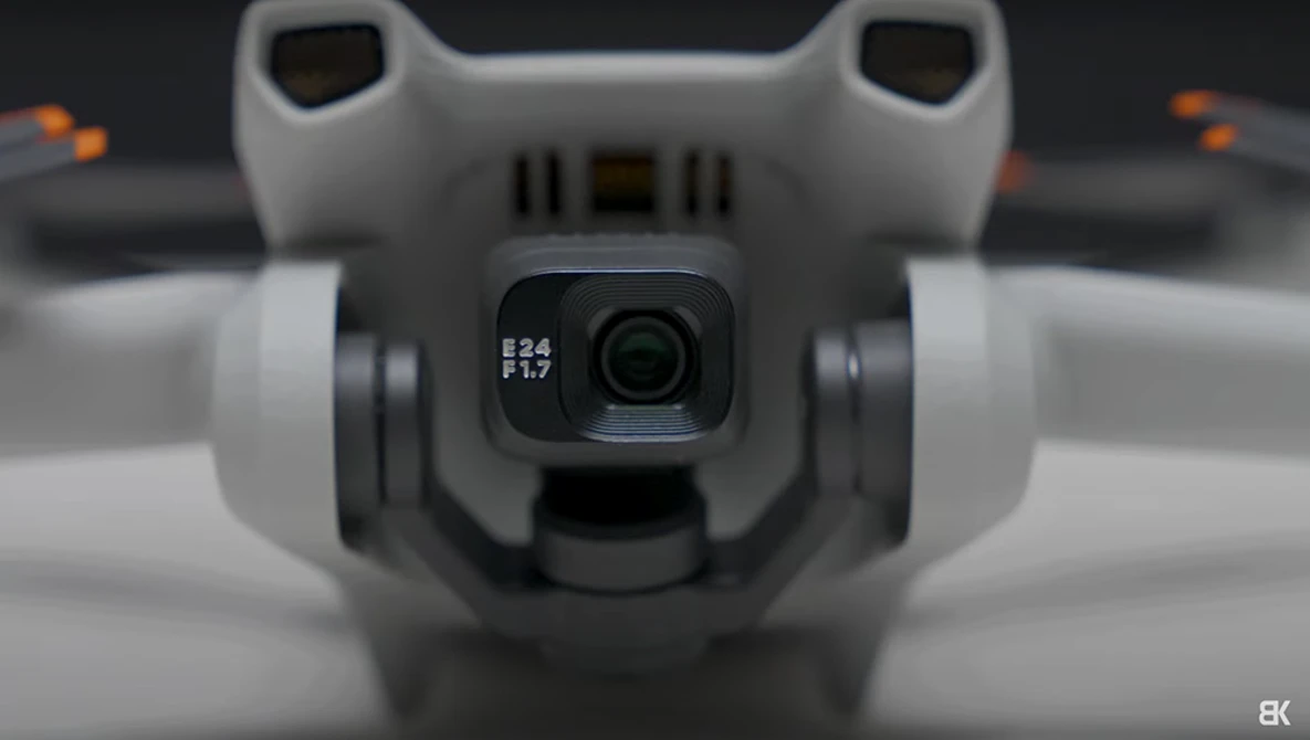 Close-up of a drone's camera gimbal showing f2.8 and f1.7 aperture settings on the lens.