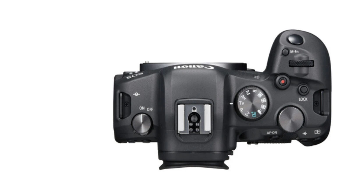Top-down view of a mirrorless camera body with articulating screen and control dials.