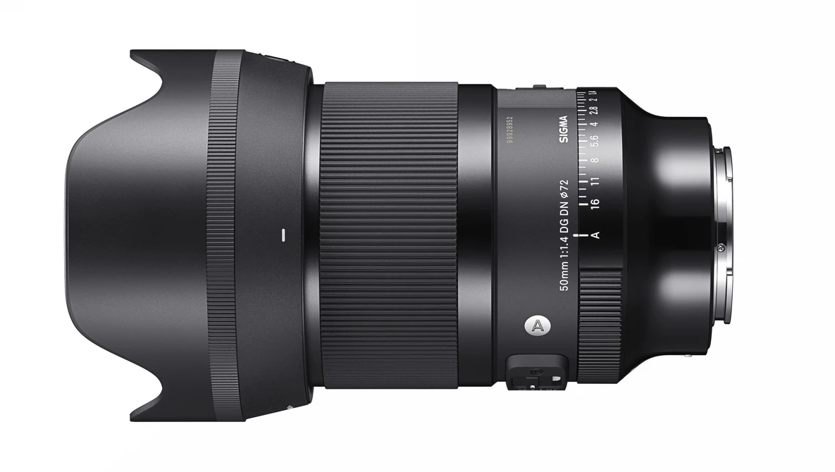 Black telephoto lens with hood and focus ring against white background.