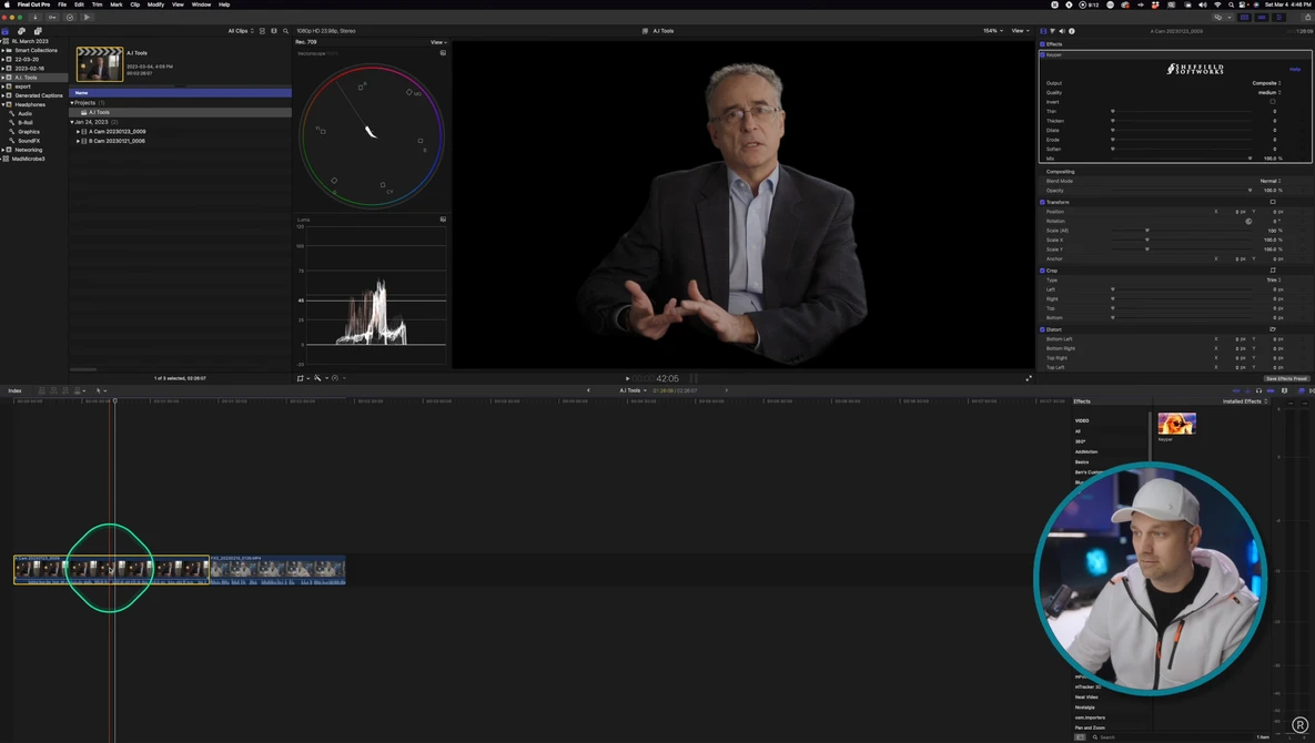 Screenshot of video editing software with color grading interface, waveform monitor, and video preview of man in business casual attire.