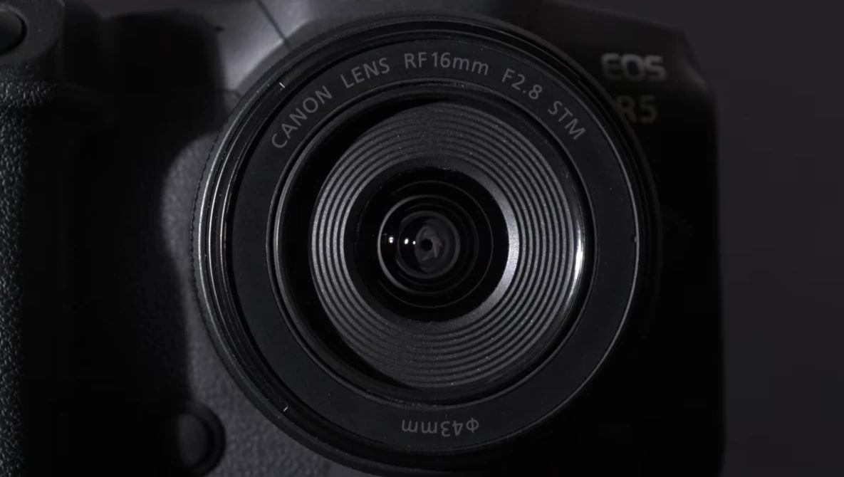 Canon RF 16mm f/2.8 STM lens mounted on an EOS R camera body, shot from above in black and white.