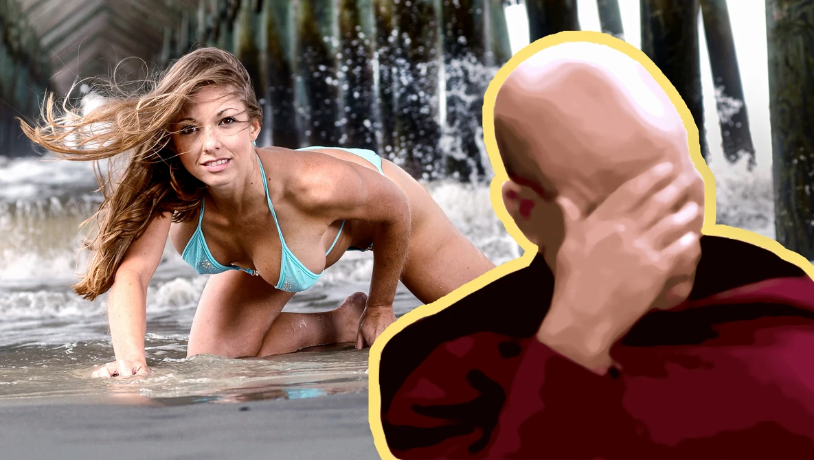 Woman in bikini posing in shallow water with pier pilings in background.