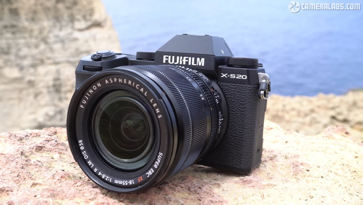 Fujifilm X-S20 mirrorless camera with Fujinon 18-55mm lens on rocky terrain.