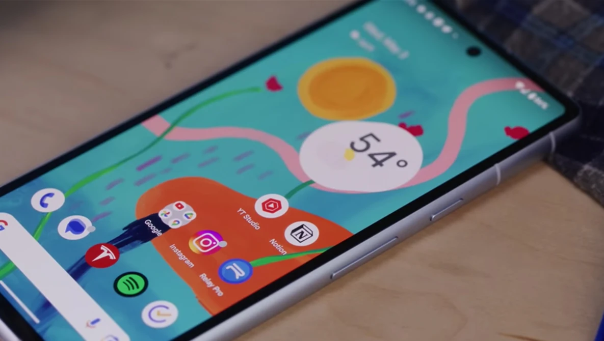 Smartphone displaying a colorful homescreen with weather widget showing 54 degrees and various app icons on a turquoise background.