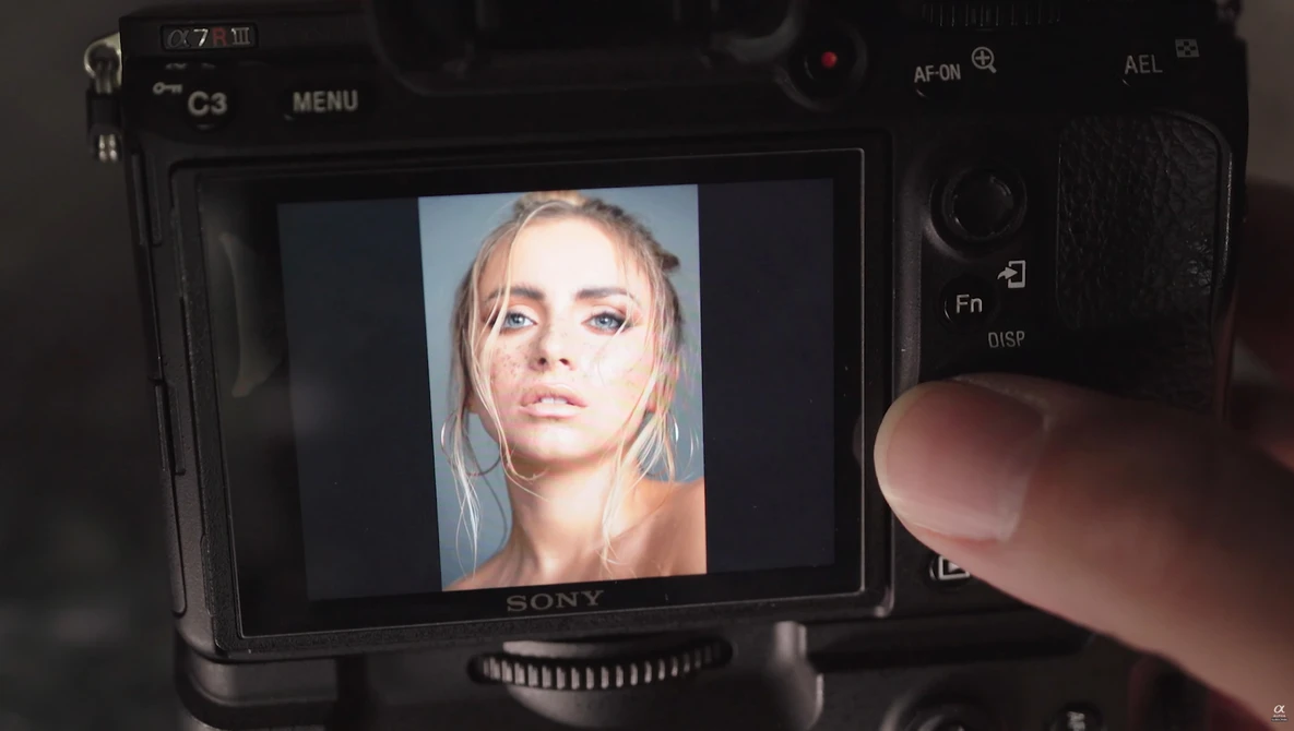 Screenshot of portrait photo displayed on Sony camera monitor during shoot.