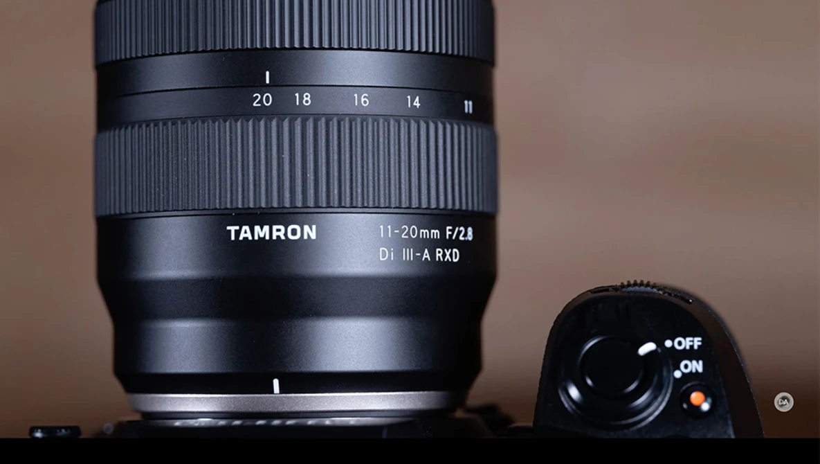 Tamron 11-20mm f/2.8 Di III-A RXD lens with focus ring and depth-of-field scale visible.