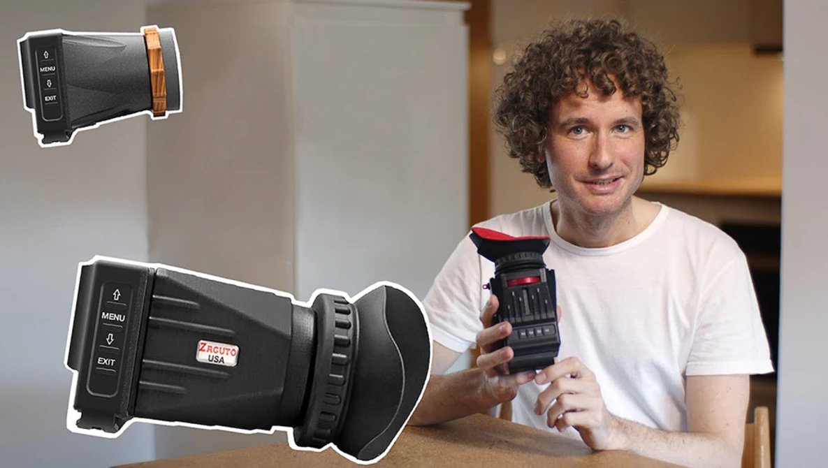 Man holding a thermal imaging camera while demonstrating handheld thermal devices.