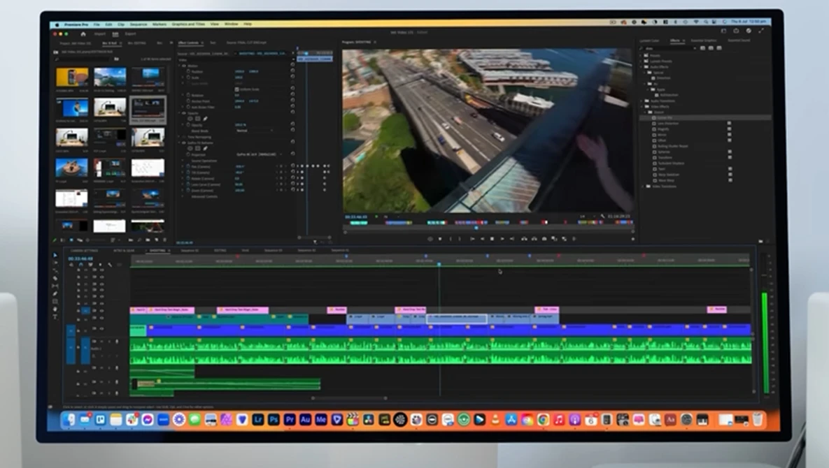 Screenshot of video editing software with aerial footage of a waterway and industrial area in the center canvas.