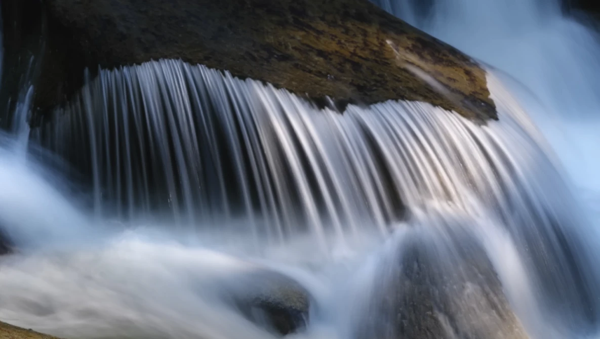 Waterfall with silky smooth water texture created using long exposure photography technique.