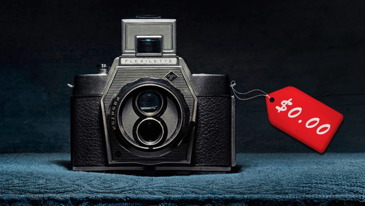 Vintage twin-lens reflex camera with a red price tag marked $40.00 attached to its side.