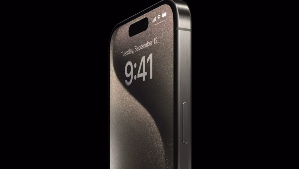 Smartphone with edge-to-edge display and minimal bezel design shown at an angle against a dark background.