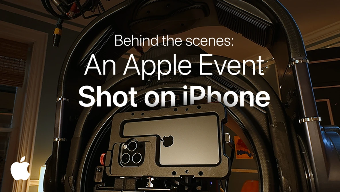 Screenshot of Apple's "Behind the scenes: An Apple Event Shot on iPhone" title card displayed on a professional film production monitor mounted inside a camera rig.
