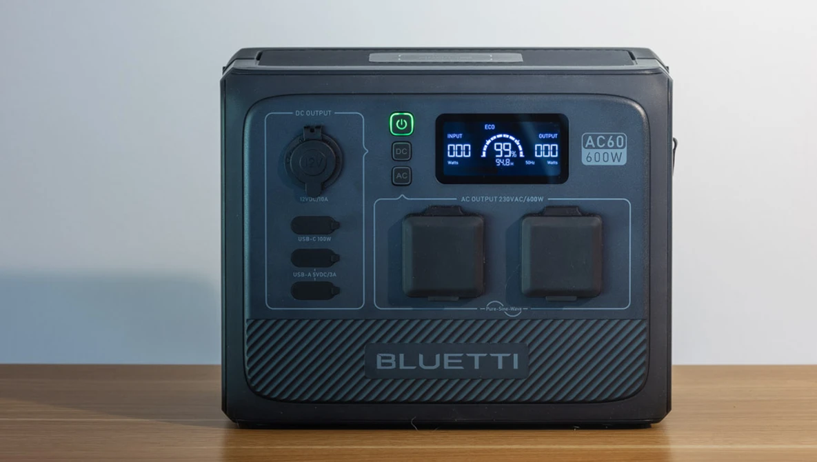 Bluetti portable power station with dual AC outlets and digital display showing power metrics.