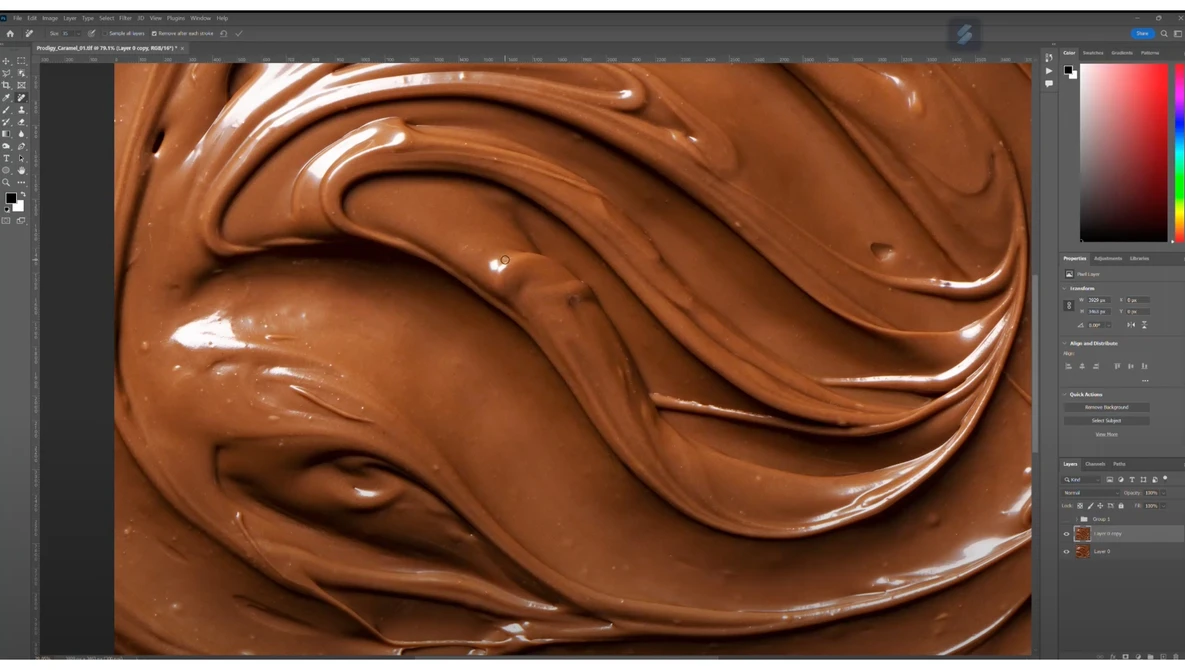 Close-up of swirled chocolate texture with glossy highlights and smooth peaks.