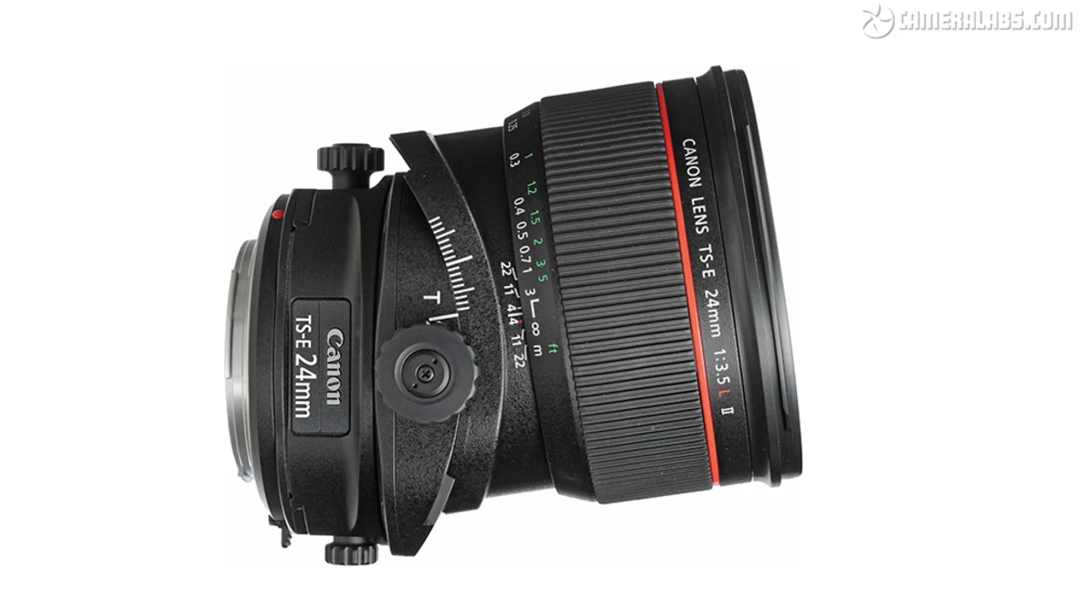 Canon TS-E 24mm tilt-shift lens and Canon 135mm telephoto lens mounted together on white background.