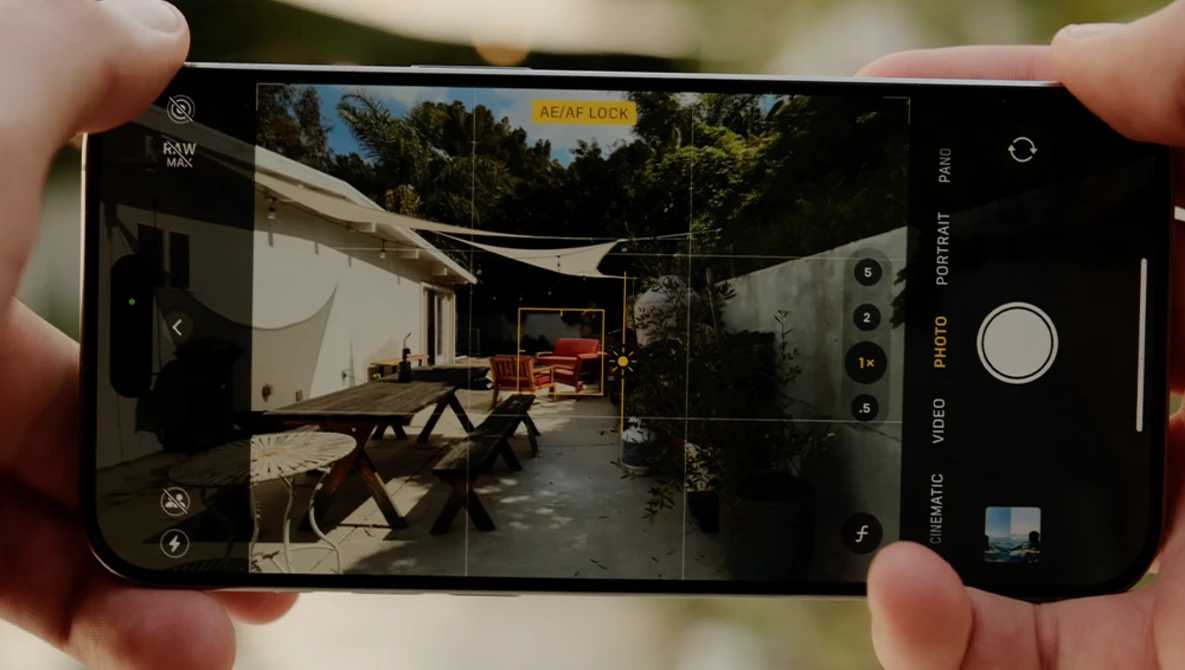 Screenshot of iPhone camera app displaying a residential courtyard with portrait mode active.
