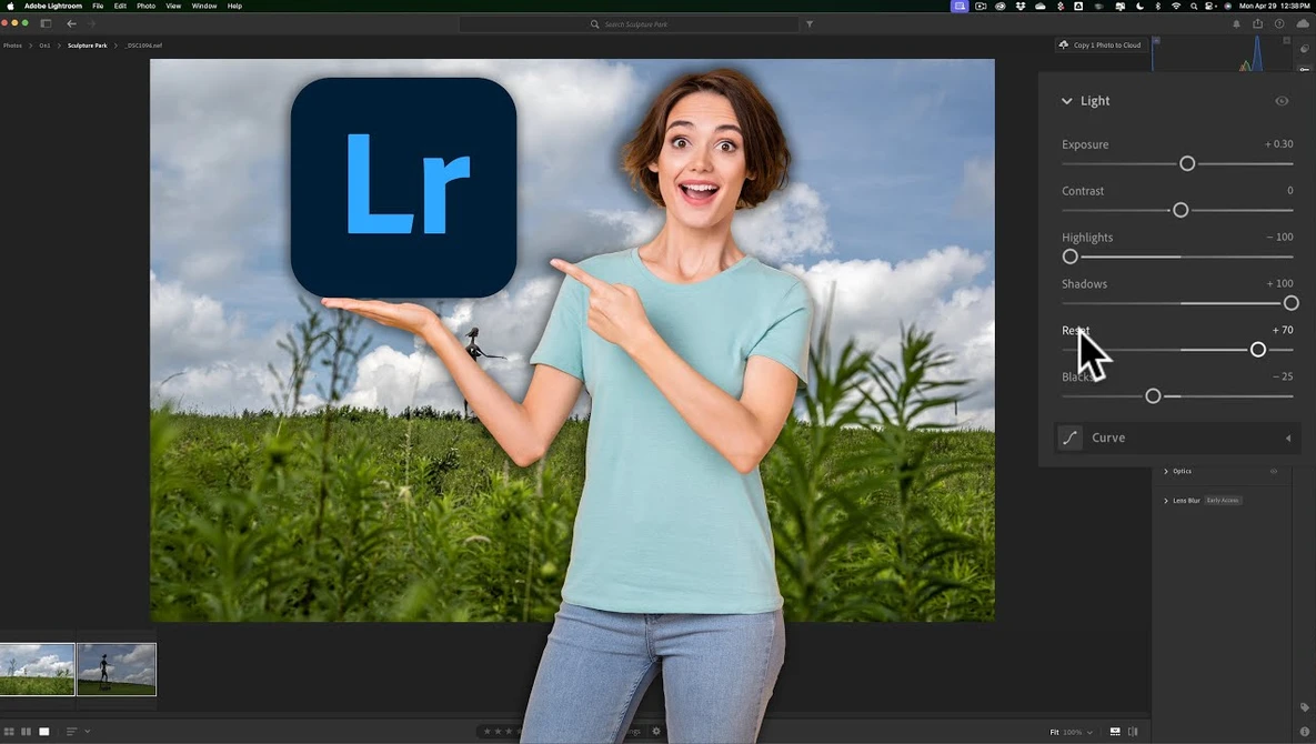 Woman in light blue shirt pointing at Lightroom logo against outdoor landscape background.