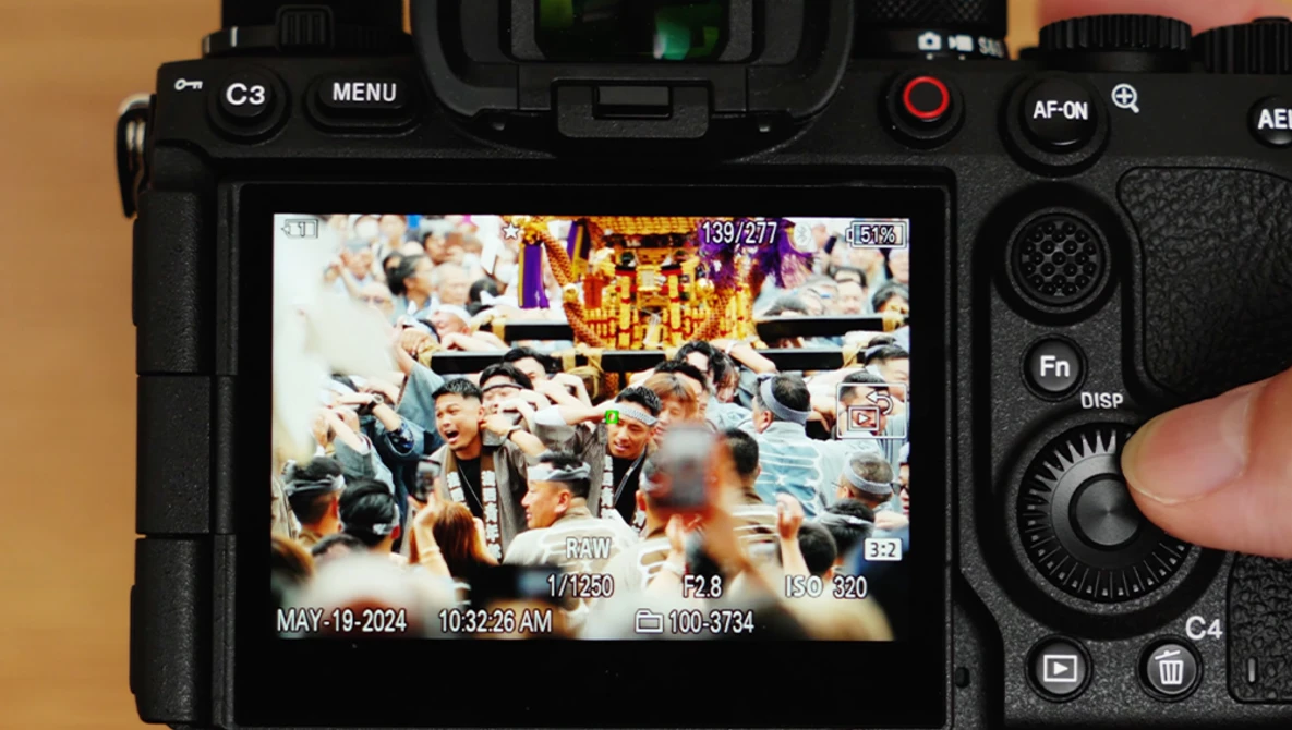 Camera rear LCD screen displaying a multi-angle video recording interface with timestamp and metadata overlays.