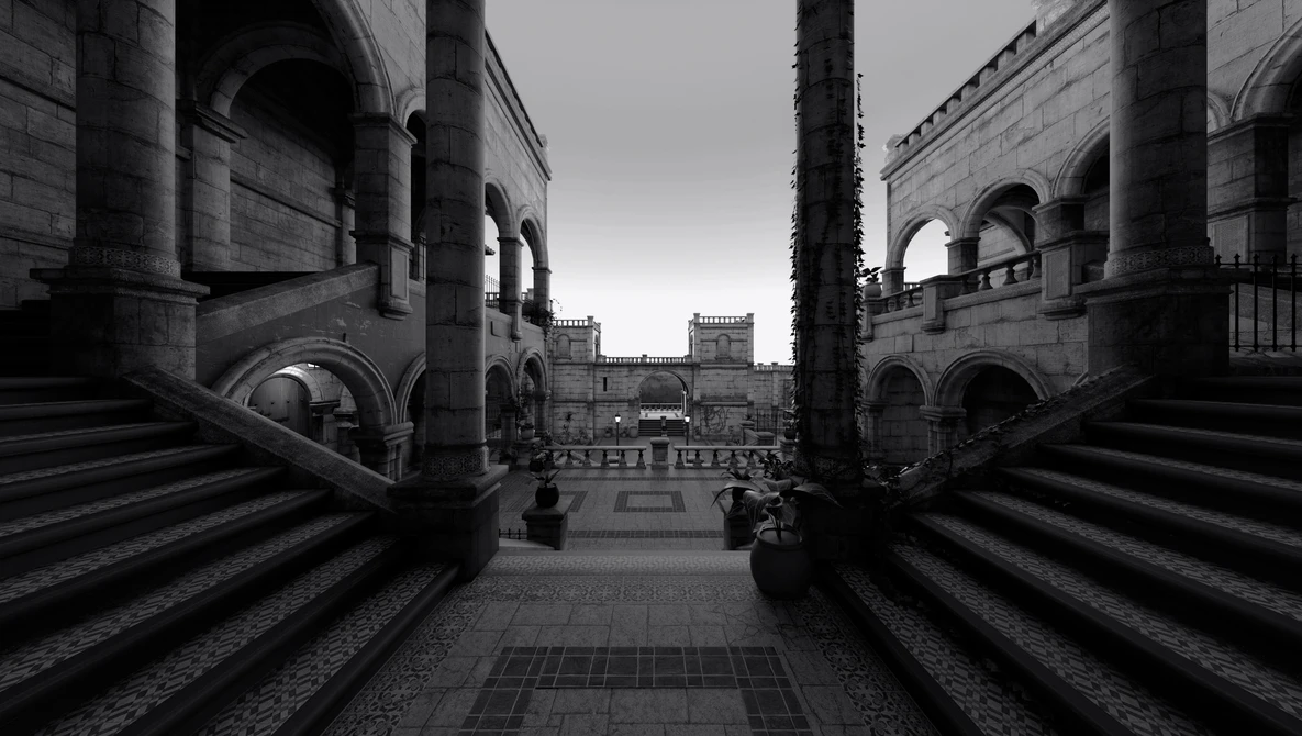 Symmetrical view down a columned corridor toward a distant piazza with classical architecture.