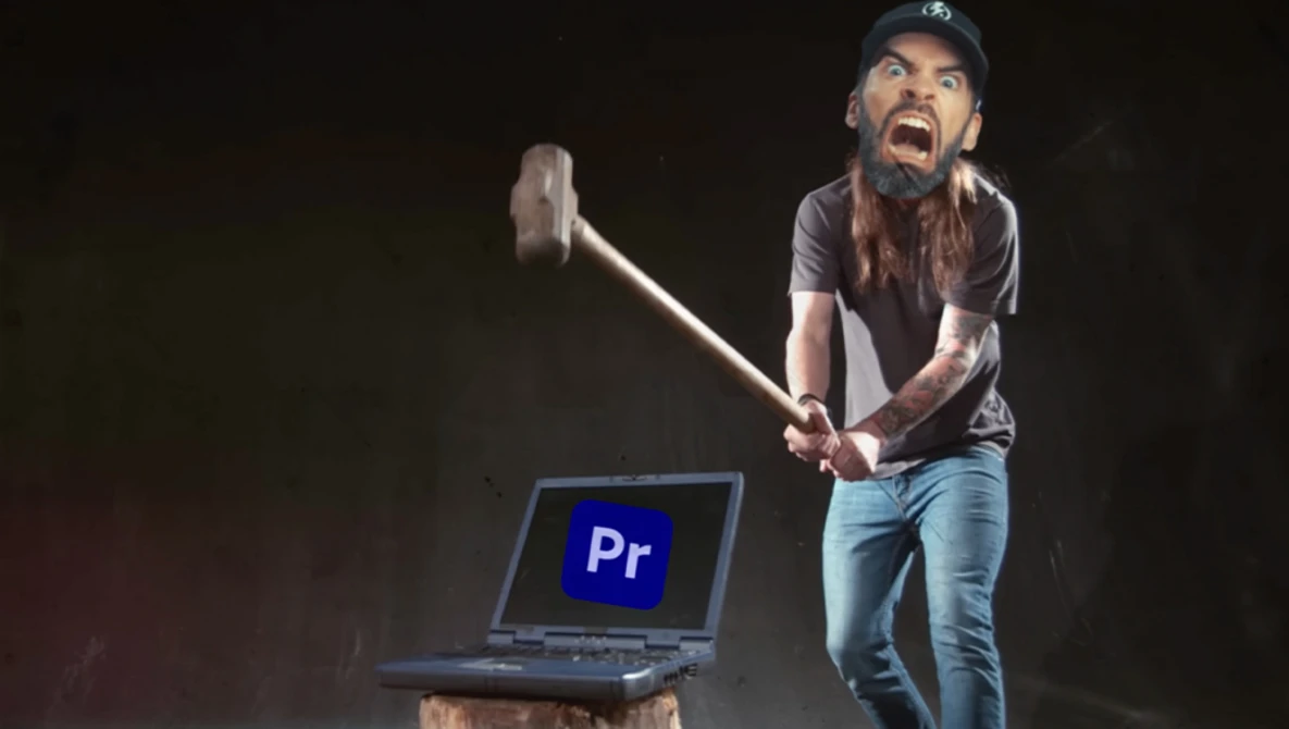 Person with axe poised above laptop displaying Adobe Premiere Pro logo against dark background.