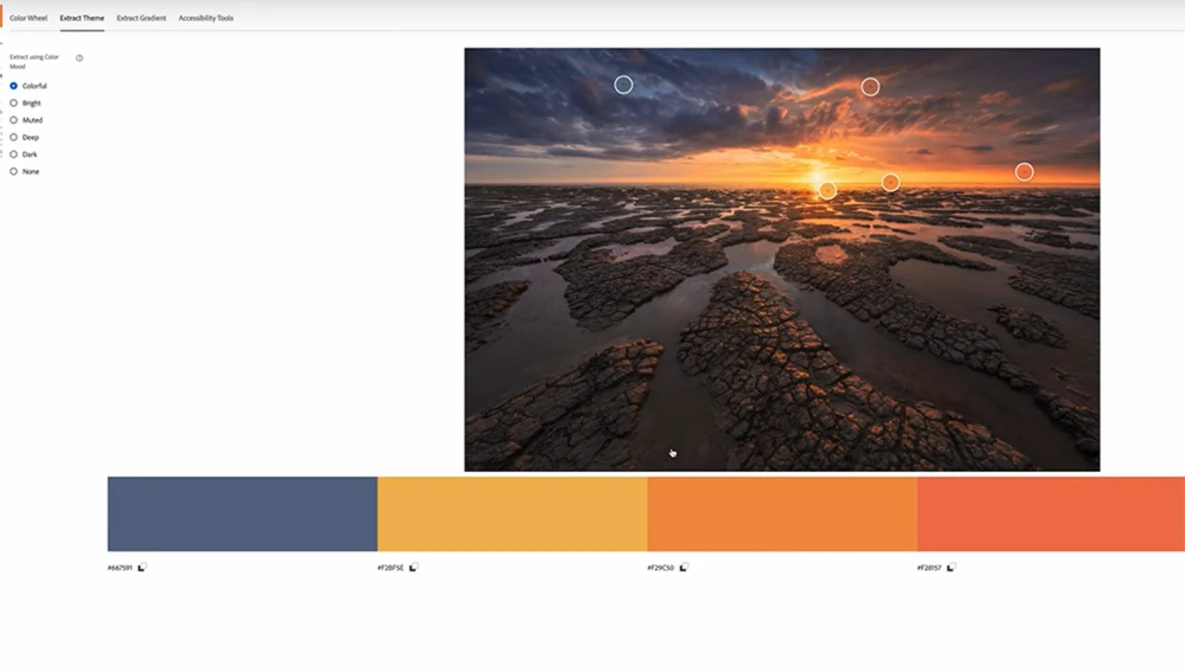 Dramatic coastal landscape at sunset with tidal flats, golden light reflecting on water, and warm-toned sky with storm clouds.