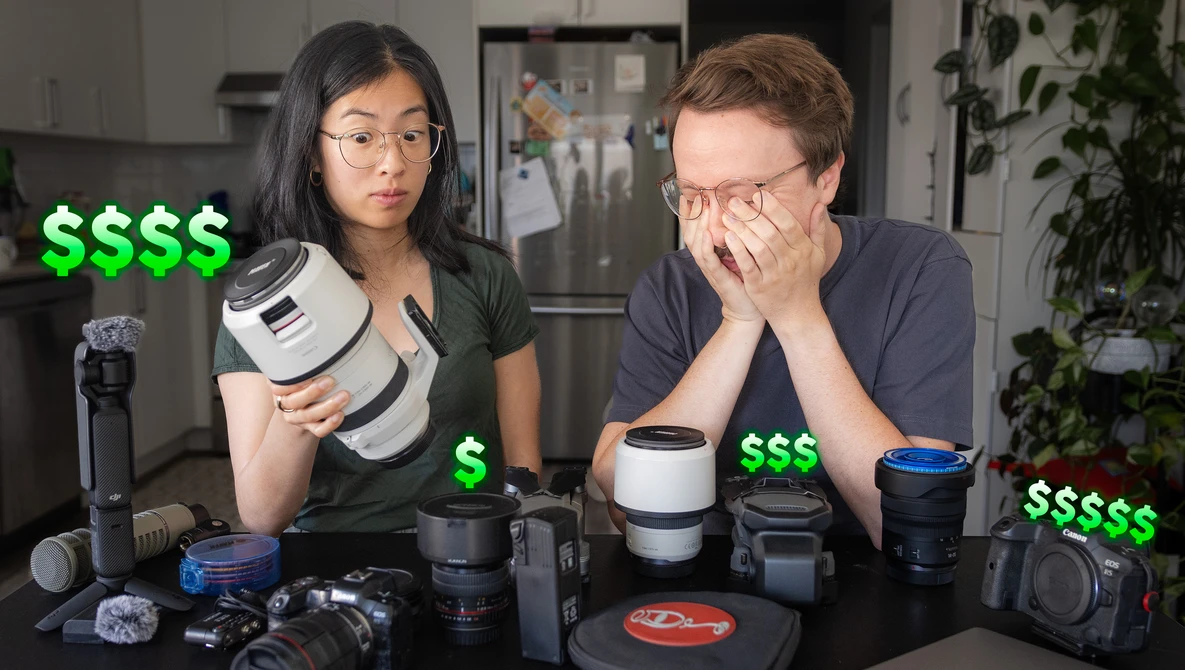 Two photographers reviewing camera gear and lenses displayed on a table with dollar sign overlays.