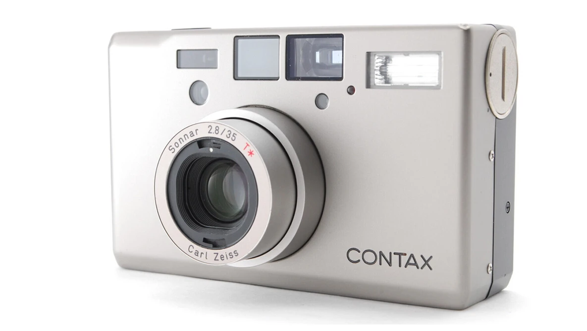 Contax compact film camera with Carl Zeiss lens, shown from front-right angle against white background.