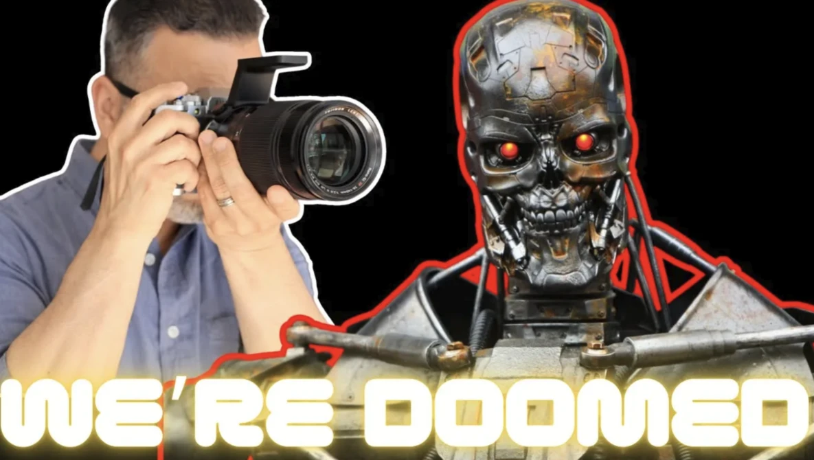 Photographer holding a DSLR camera next to a robotic skull with glowing red eyes and red accent lighting.