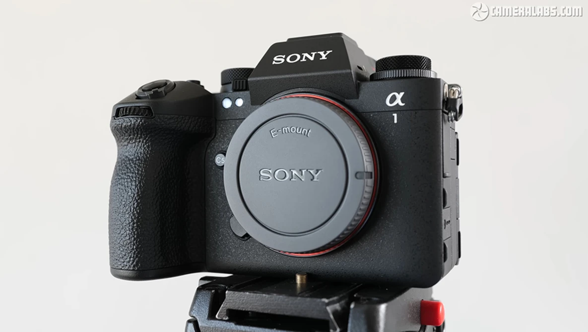 Sony a1 mirrorless camera body mounted on a tripod plate, shown from the front against a neutral background.