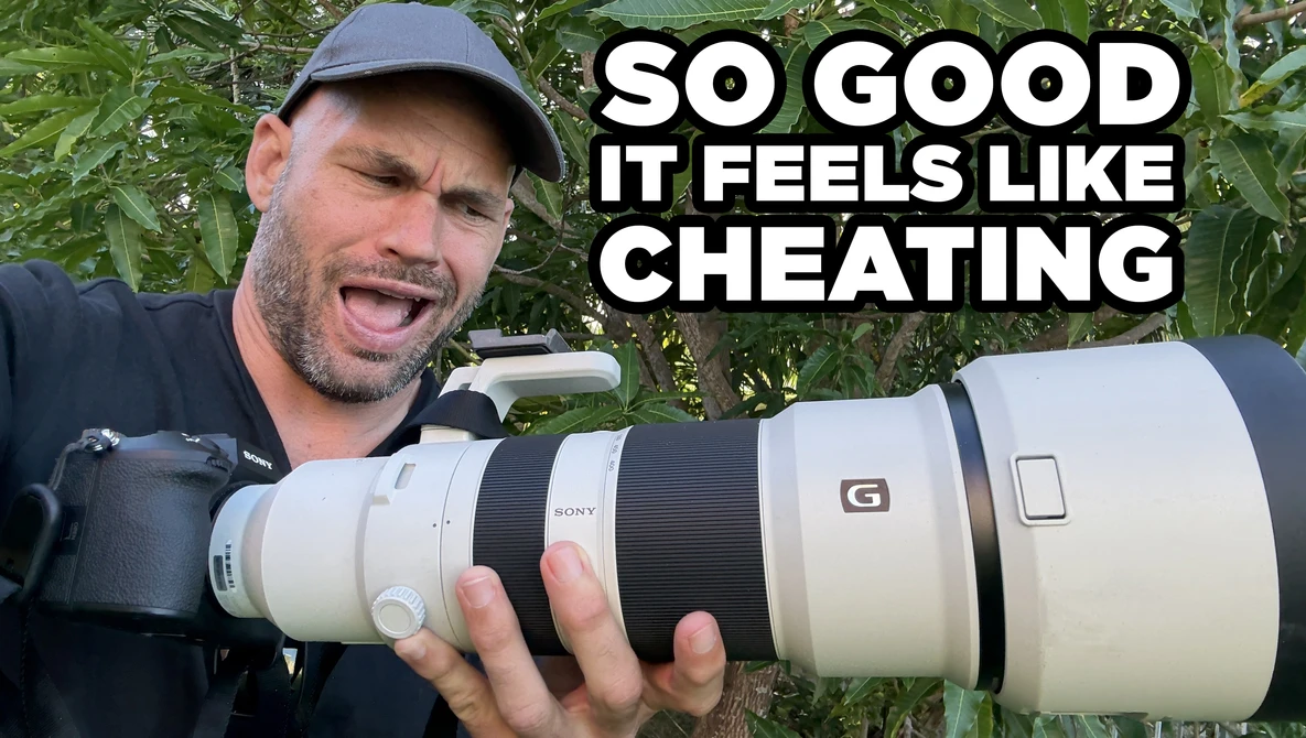Photographer holding a white telephoto lens outdoors with text overlay saying "SO GOOD IT FEELS LIKE CHEATING."